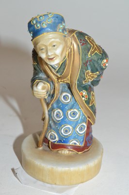 Lot 221 - A Japanese Satsuma ware figure of a sage on...
