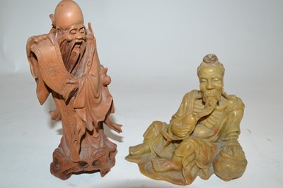 Lot 226 - A Chinese soap stone carved figure of an...