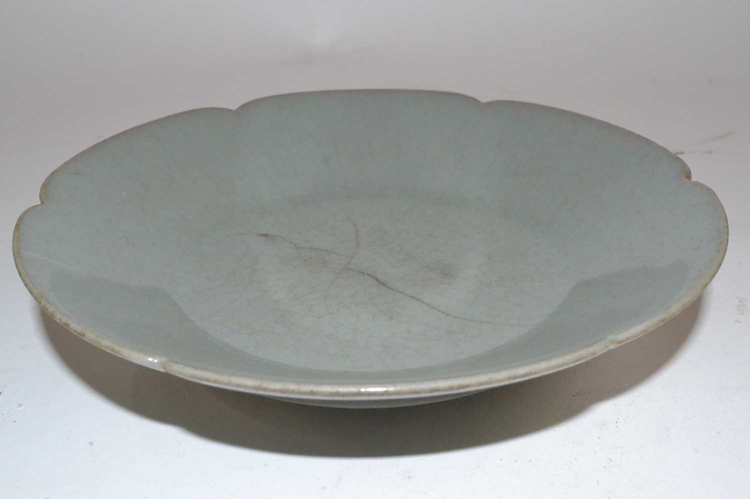 Lot 272 - A Chinese celadon dish of petal shape possibly...