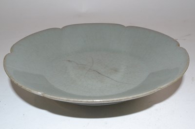 Lot 272 - A Chinese celadon dish of petal shape possibly...