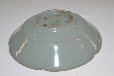 Lot 272 - A Chinese celadon dish of petal shape possibly...
