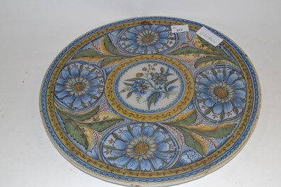 Lot 277 - A large Delft faience charger with polychrome...