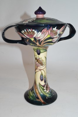 Lot 287 - A Moorcroft vase and cover in florian style...