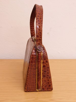Lot 124 - A brown leather moc-croc patent leather...