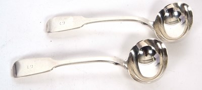 Lot 157 - A pair of William IV fiddle pattern sauce...
