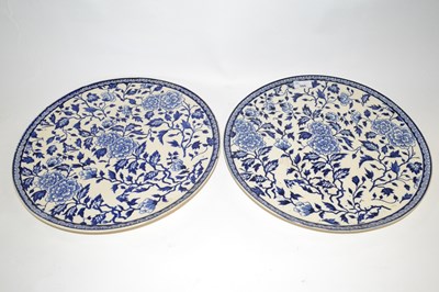 Lot 306 - A pair of large pottery chargers with a blue...