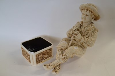Lot 306A - A Bretby model of a boy seated with flute...
