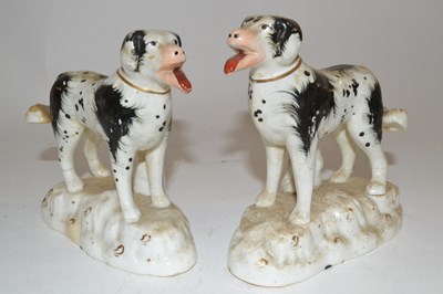 Lot 316 - A pair of Staffordshire models of dogs with...