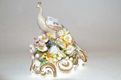 Lot 319 - A Derby (S&H) model of a peacock seated on a...