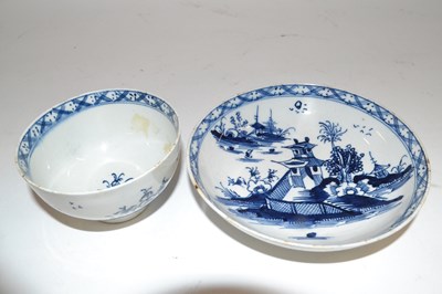 Lot 320 - A Lowestoft porcelain tea bowl and saucer,...