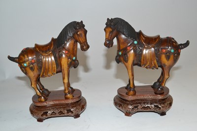 Lot 364 - A box containing a pair of Tang style horses...