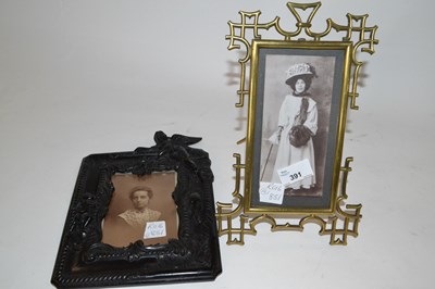 Lot 391 - An Art Nouveau brass photo frame in Chinese...
