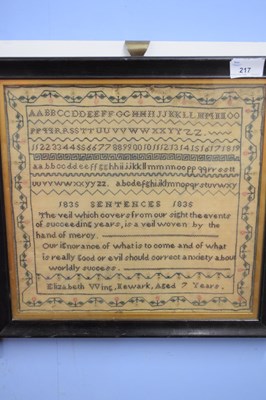 Lot 217 - A sampler silk/wool stitched on gauze,...
