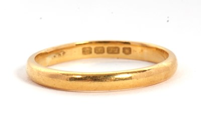 Lot 24 - A 22ct wedding band, hallmarked London 1953,...