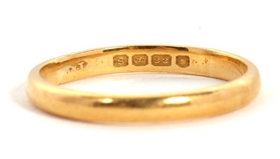 Lot 24 - A 22ct wedding band, hallmarked London 1953,...