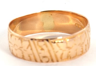 Lot 27 - A late Victorian 18ct gold ring, with chased...