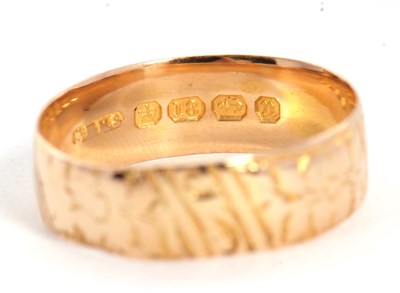 Lot 27 - A late Victorian 18ct gold ring, with chased...