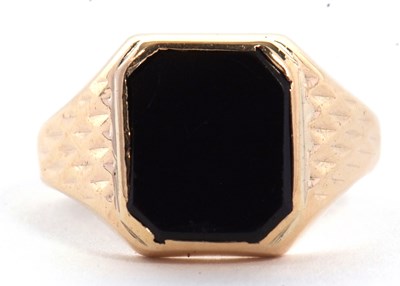 Lot 33 - A 9ct onyx ring, the squared onyx in rubover...