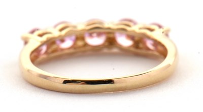 Lot 71 - A 14ct pink CZ ring, set with five round pink...