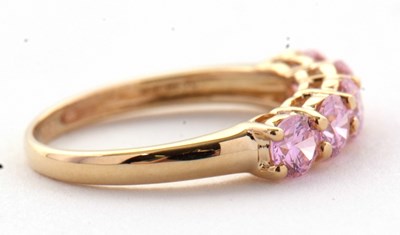 Lot 71 - A 14ct pink CZ ring, set with five round pink...