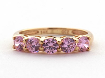 Lot 71 - A 14ct pink CZ ring, set with five round pink...