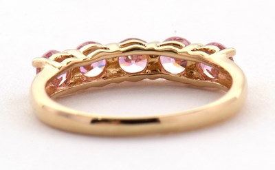 Lot 71 - A 14ct pink CZ ring, set with five round pink...