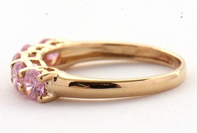Lot 71 - A 14ct pink CZ ring, set with five round pink...