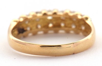 Lot 72 - A diamond ring, the upper half set with small...