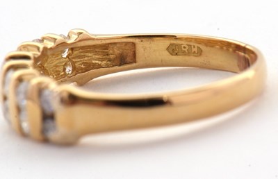 Lot 72 - A diamond ring, the upper half set with small...