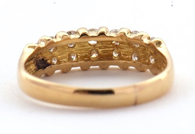 Lot 72 - A diamond ring, the upper half set with small...