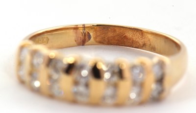 Lot 72 - A diamond ring, the upper half set with small...