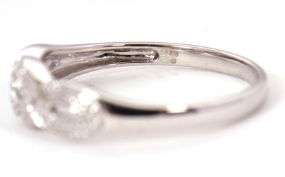 Lot 70 - A 9ct diamond ring, the upper half set with...