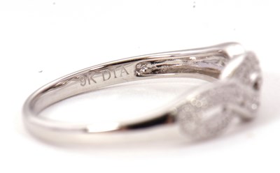 Lot 70 - A 9ct diamond ring, the upper half set with...