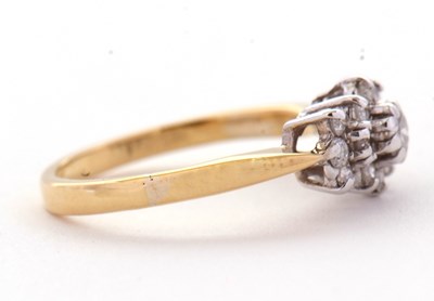 Lot 68 - A diamond cluster ring, set with round...