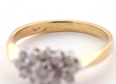 Lot 68 - A diamond cluster ring, set with round...