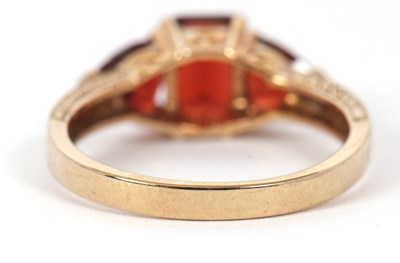 Lot 76 - A 9ct garnet ring, set with a step cut garnet...