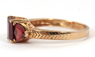 Lot 76 - A 9ct garnet ring, set with a step cut garnet...