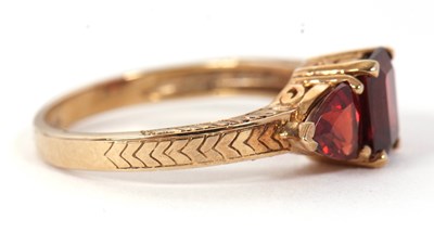 Lot 76 - A 9ct garnet ring, set with a step cut garnet...