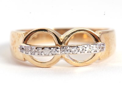 Lot 78 - A diamond ring, set with two circles crossed...