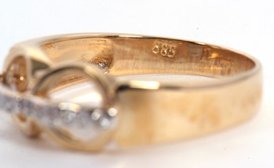 Lot 78 - A diamond ring, set with two circles crossed...