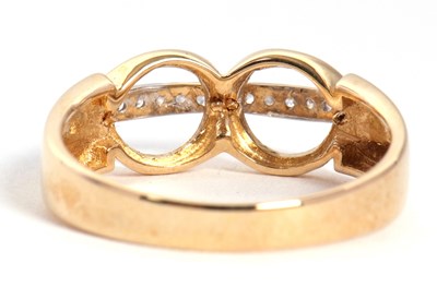 Lot 78 - A diamond ring, set with two circles crossed...