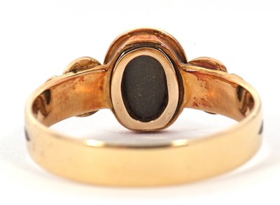 Lot 54 - A 19th century mourning ring, the central oval...