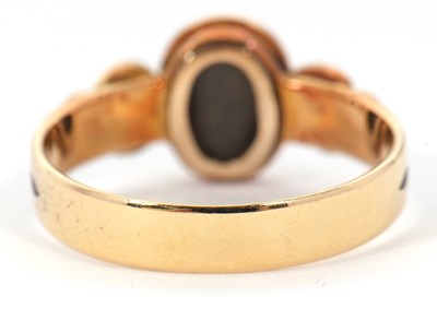 Lot 54 - A 19th century mourning ring, the central oval...