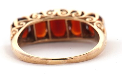 Lot 75 - A 9ct garnet ring, the five oval graduated...