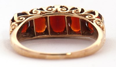 Lot 75 - A 9ct garnet ring, the five oval graduated...
