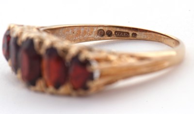 Lot 75 - A 9ct garnet ring, the five oval graduated...