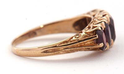 Lot 75 - A 9ct garnet ring, the five oval graduated...