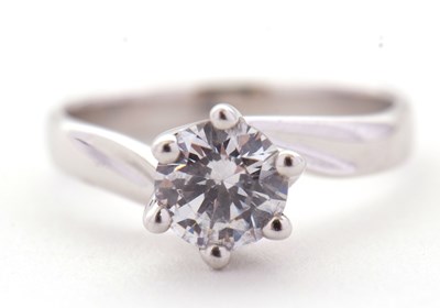 Lot 31 - A 9ct white gold CZ ring, the round CZ, in...