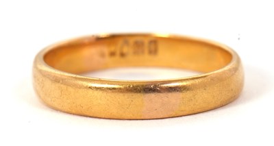 Lot 260 - A 22ct wedding band, stamped 22 with London...