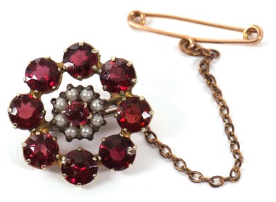 Lot 85 - A garnet brooch, set to centre with a small...